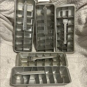 5 vintage aluminum ice cube trays.
